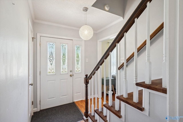 9410 Valley Ln, Huntsville, AL 35803 - foyer with ornamental molding, stairs, and a textured ceiling
