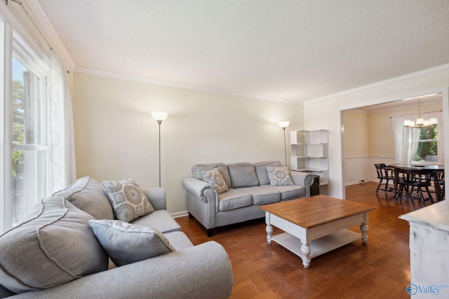 9410 Valley Ln, Huntsville, AL 35803 - living room with a chandelier, wood finished floors, ornamental molding, and a textured ceiling