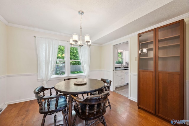 9410 Valley Ln, Huntsville, AL 35803 - dining space featuring a chandelier, hardwood / wood-style flooring, and ornamental molding
