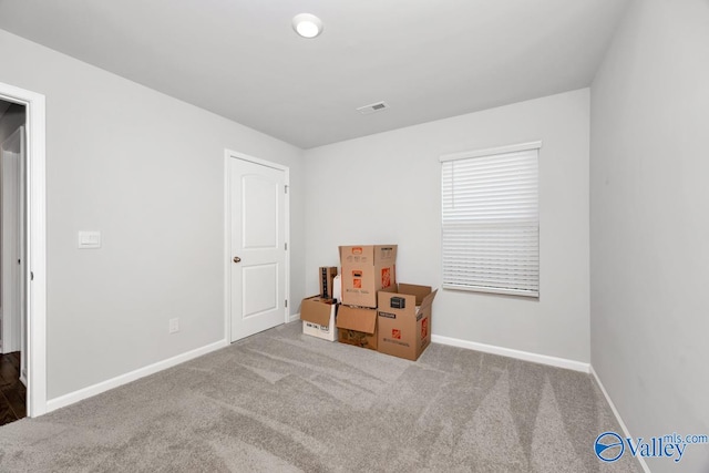 unfurnished bedroom featuring light colored carpet