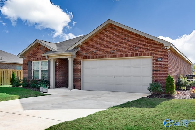 view of front of property featuring a garage and a front lawn