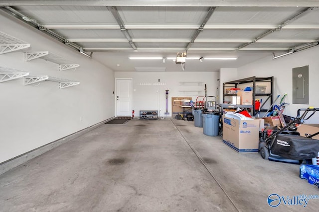 garage with a garage door opener and electric panel