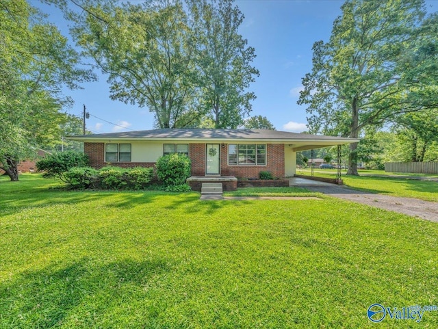 605 Hereford Dr, Athens, AL 35611 - single story home with asphalt driveway, an attached carport, and brick siding