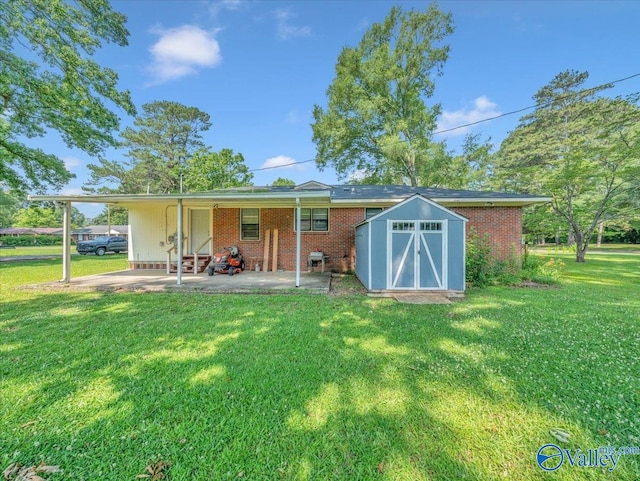 605 Hereford Dr, Athens, AL 35611 - rear view of property with a yard, brick siding, and a patio
