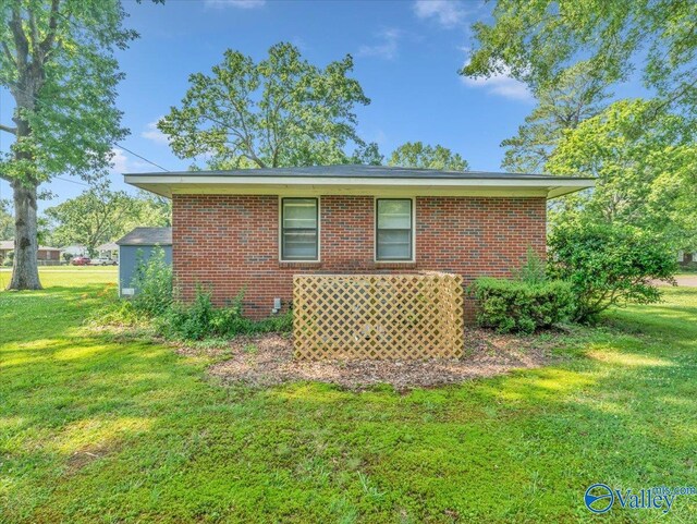 605 Hereford Dr, Athens, AL 35611 - view of side of home featuring a yard and brick siding