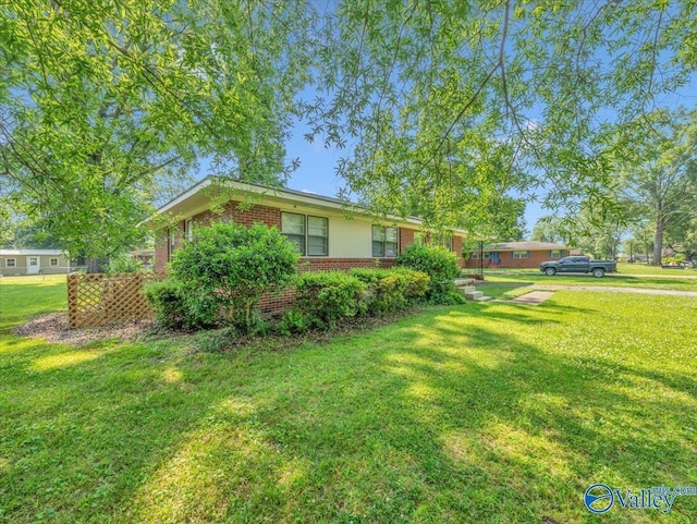 605 Hereford Dr, Athens, AL 35611 - view of home's exterior featuring brick siding and a lawn