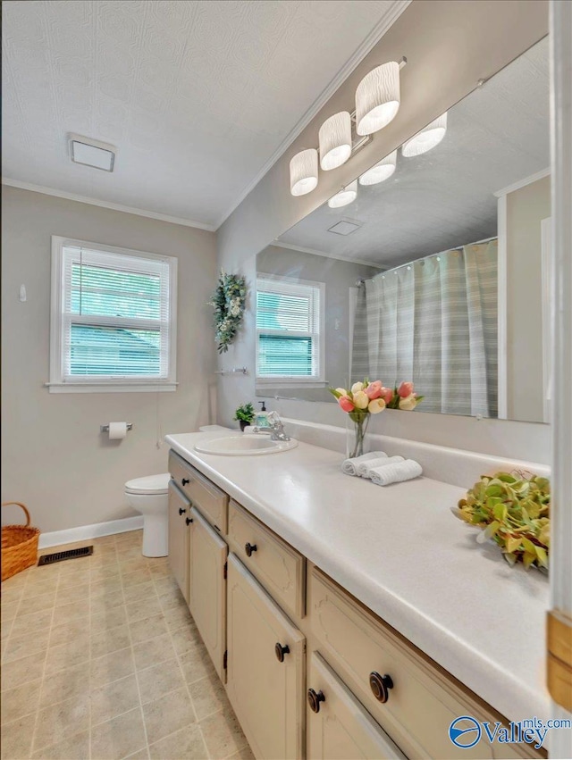605 Hereford Dr, Athens, AL 35611 - bathroom with vanity, baseboards, toilet, crown molding, and a shower with shower curtain