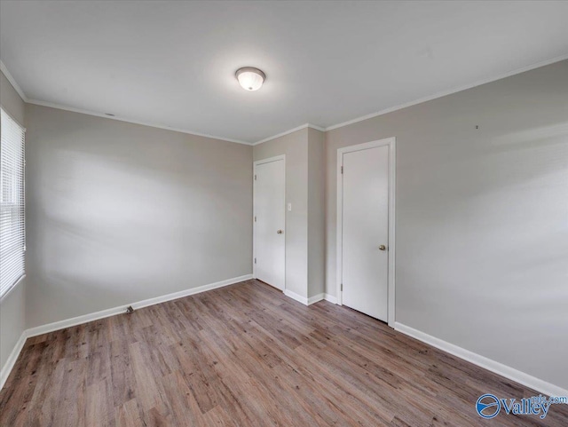 605 Hereford Dr, Athens, AL 35611 - unfurnished room with wood finished floors, baseboards, crown molding, and healthy amount of natural light