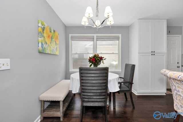 211 Kent Rd SW, Huntsville, AL 35801 - dining space featuring a chandelier, dark wood-style flooring, and baseboards
