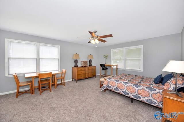211 Kent Rd SW, Huntsville, AL 35801 - carpeted bedroom featuring baseboards and a ceiling fan