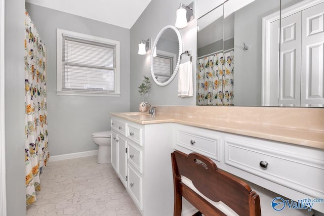 211 Kent Rd SW, Huntsville, AL 35801 - bathroom with toilet, vanity, baseboards, and a shower with curtain
