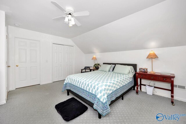 211 Kent Rd SW, Huntsville, AL 35801 - bedroom with carpet floors, vaulted ceiling, baseboards, a closet, and a ceiling fan