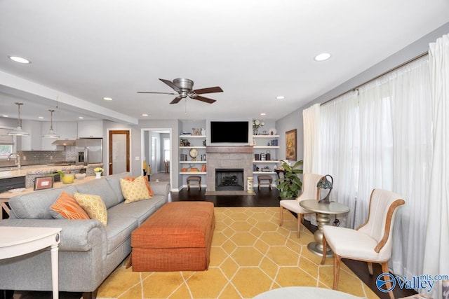 211 Kent Rd SW, Huntsville, AL 35801 - living room featuring recessed lighting, a ceiling fan, a fireplace, and light tile patterned floors