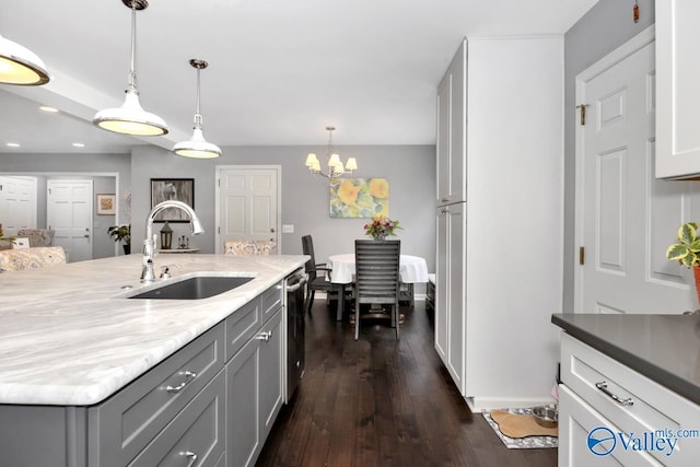211 Kent Rd SW, Huntsville, AL 35801 - kitchen featuring a sink, gray cabinets, dark wood-style flooring, hanging light fixtures, and a chandelier