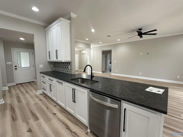 kitchen featuring crown molding, white cabinetry, a sink, light wood-type flooring, and dishwasher