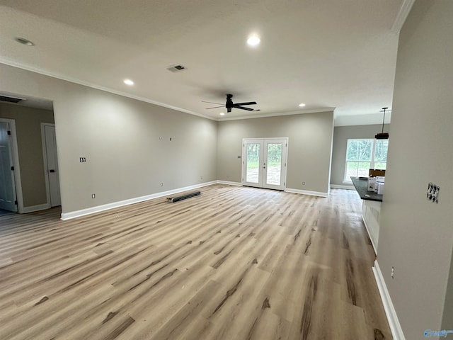 unfurnished living room featuring light wood finished floors, baseboards, visible vents, french doors, and recessed lighting