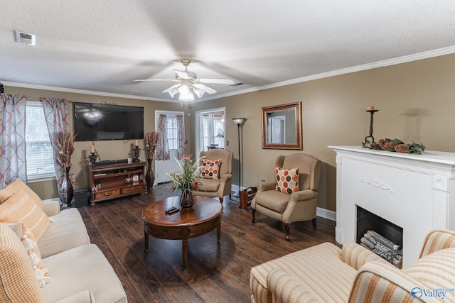 living room with ornamental molding, a textured ceiling, ceiling fan, and dark hardwood / wood-style floors