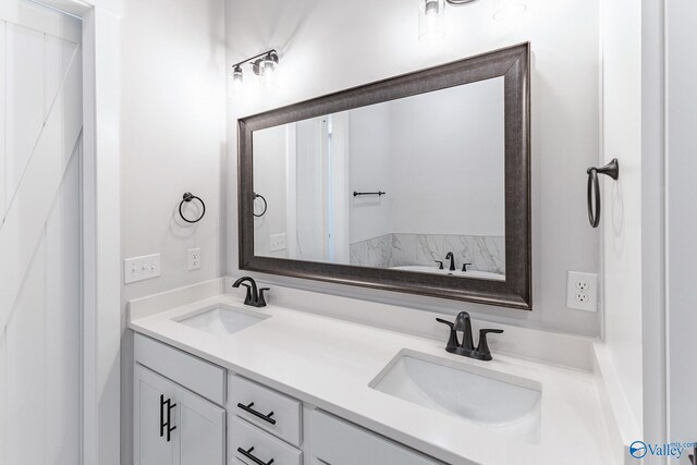 bathroom with dual bowl vanity