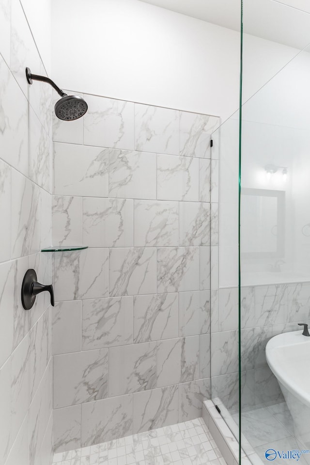 bathroom with tiled shower