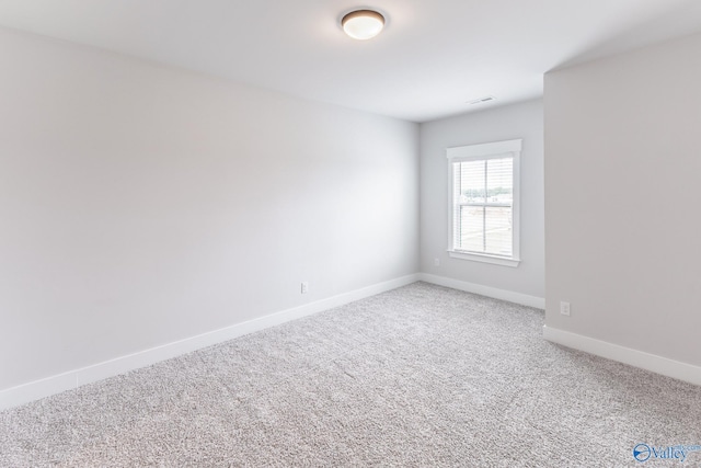 unfurnished room with carpet flooring