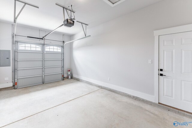 garage featuring a garage door opener and electric panel