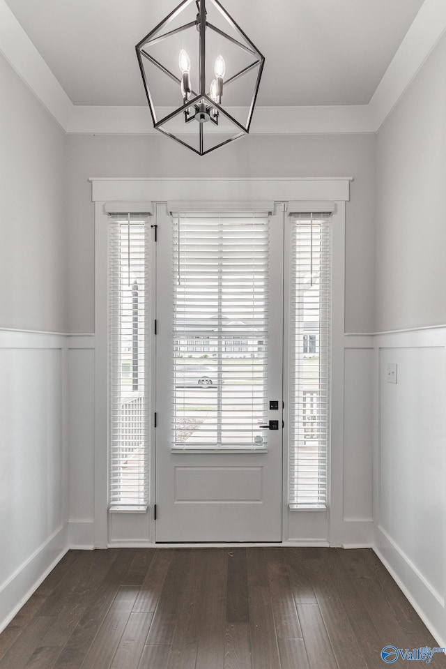 entryway with a chandelier, dark hardwood / wood-style flooring, and a healthy amount of sunlight