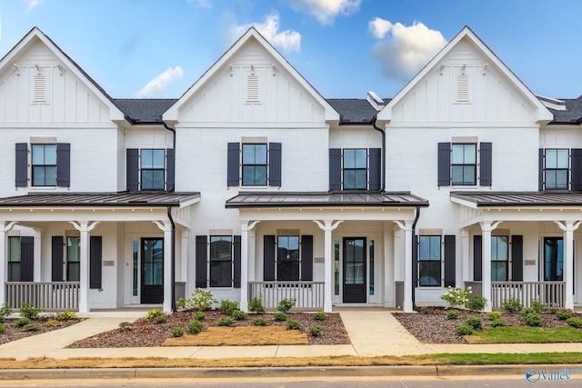 modern farmhouse style home with covered porch