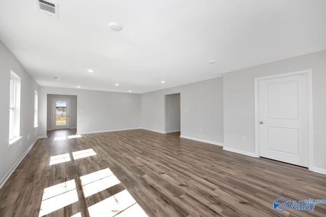 unfurnished living room with wood-type flooring