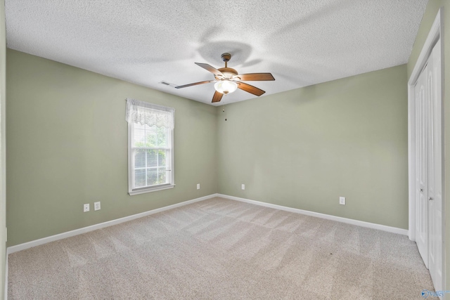 221 Badger Dr, Harvest, AL 35749 - spare room featuring ceiling fan, light colored carpet, baseboards, and a textured ceiling