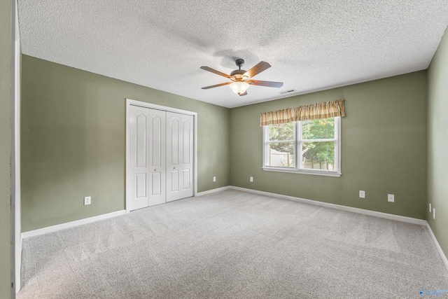 221 Badger Dr, Harvest, AL 35749 - unfurnished bedroom with a closet, baseboards, a textured ceiling, and carpet flooring