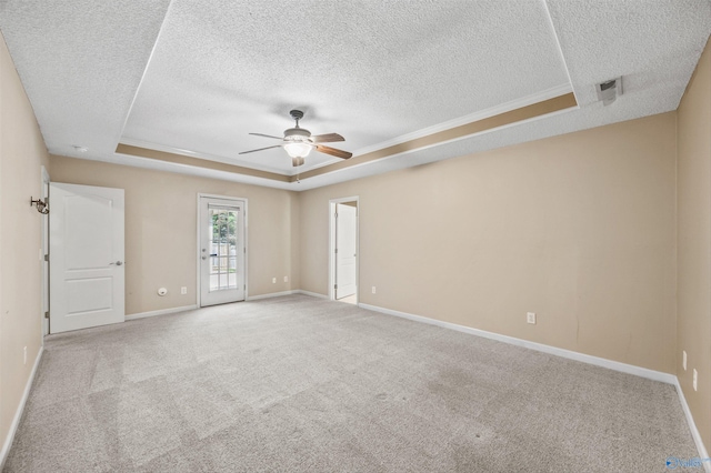 221 Badger Dr, Harvest, AL 35749 - unfurnished room featuring a raised ceiling, a textured ceiling, a ceiling fan, carpet flooring, and baseboards
