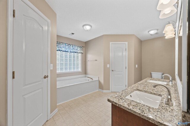 221 Badger Dr, Harvest, AL 35749 - full bathroom with a bath, double vanity, baseboards, and tile patterned flooring