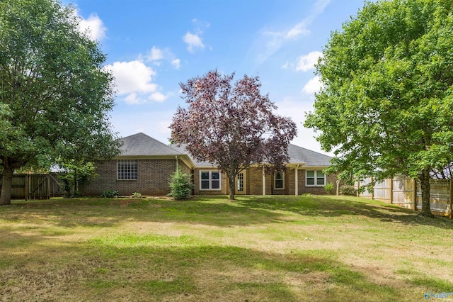 221 Badger Dr, Harvest, AL 35749 - rear view of house with brick siding