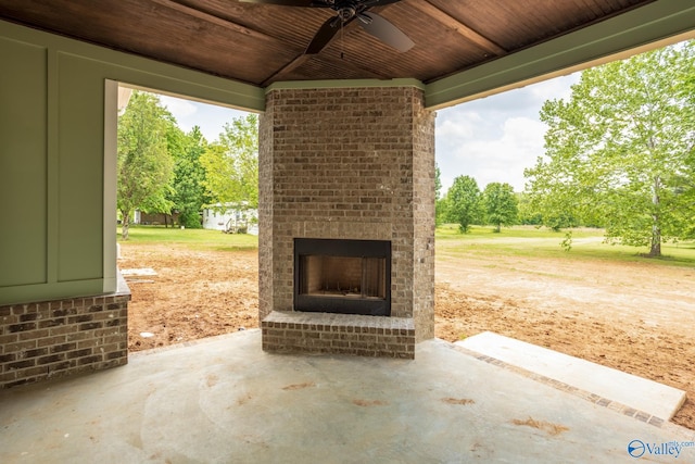 view of patio / terrace with an outdoor brick fireplace and ceiling fan