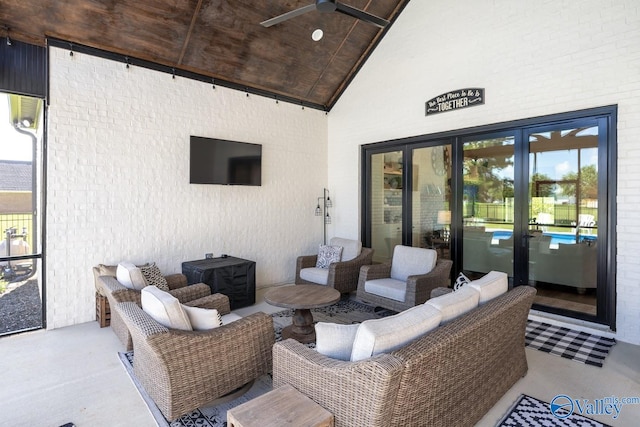 view of patio / terrace with an outdoor living space, ceiling fan, and french doors