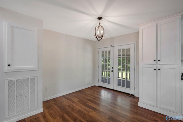 3621 Al Highway 36, Moulton, AL 35650 - unfurnished dining area featuring french doors, baseboards, dark wood finished floors, and a chandelier
