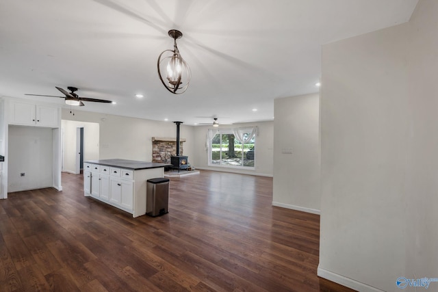 3621 Al Highway 36, Moulton, AL 35650 - kitchen with a ceiling fan, a wood stove, dark wood finished floors, and recessed lighting
