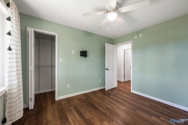 3621 Al Highway 36, Moulton, AL 35650 - unfurnished bedroom with wood finished floors, baseboards, a closet, and a ceiling fan