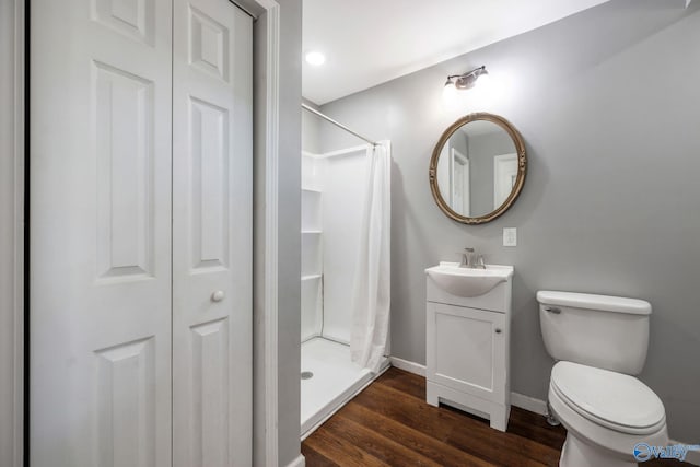 3621 Al Highway 36, Moulton, AL 35650 - bathroom featuring a closet, a stall shower, vanity, and wood finished floors