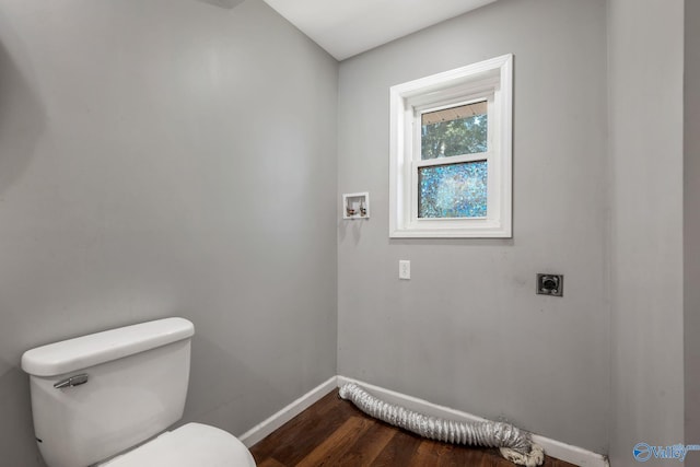 3621 Al Highway 36, Moulton, AL 35650 - bathroom with toilet, baseboards, and wood finished floors