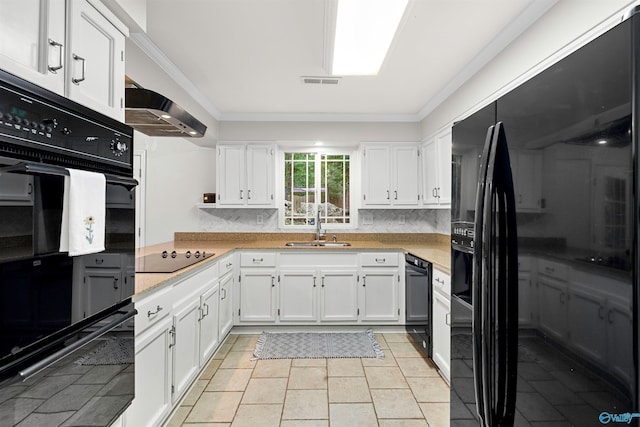 kitchen with ornamental molding, white cabinetry, black appliances, and sink