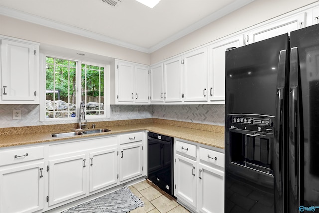 kitchen with sink, black appliances, white cabinetry, and decorative backsplash