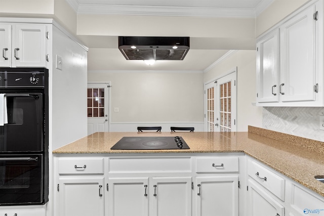 kitchen with white cabinetry, crown molding, black appliances, and french doors