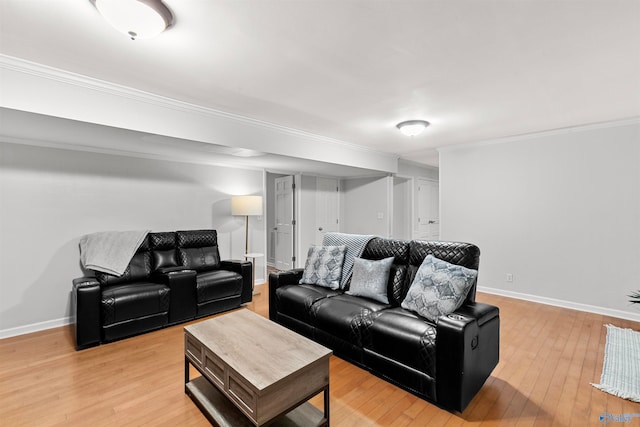 living room featuring ornamental molding and hardwood / wood-style flooring