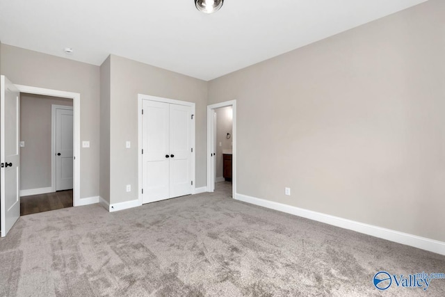 unfurnished bedroom with a closet and carpet