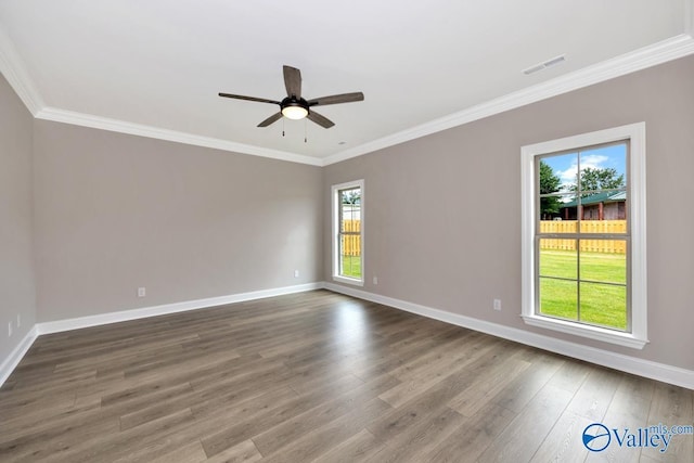 spare room featuring ornamental molding, dark hardwood / wood-style floors, and ceiling fan