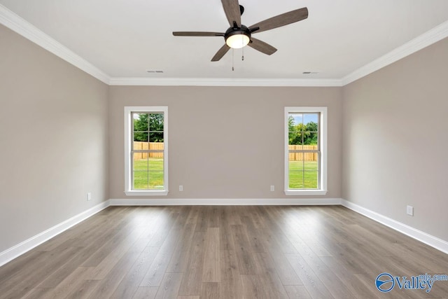 unfurnished room featuring crown molding, light hardwood / wood-style floors, and ceiling fan