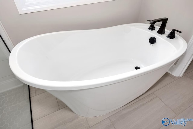 bathroom featuring a bathtub and tile patterned floors