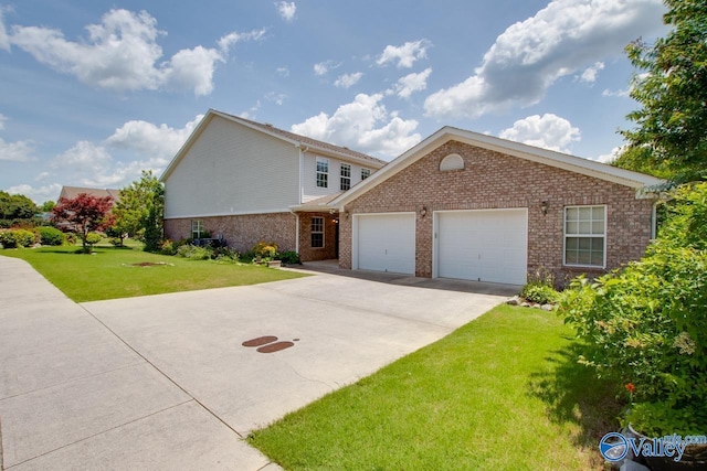 view of front of house featuring a garage and a front lawn