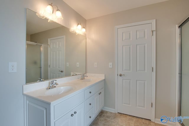 bathroom with walk in shower and vanity